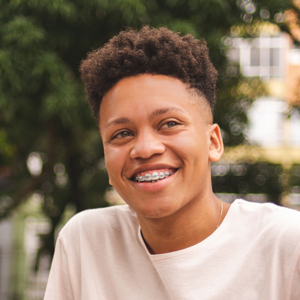 teenager smiling outdoor - preventive dentistry