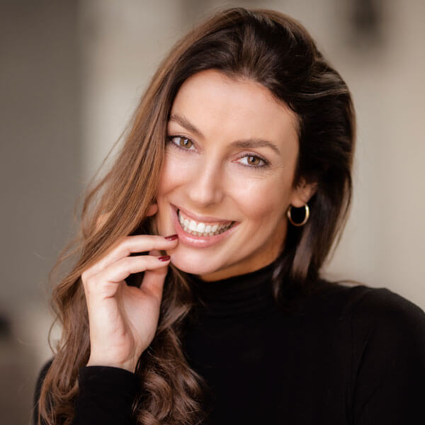 cheerful smiling woman wearing black turtleneck
